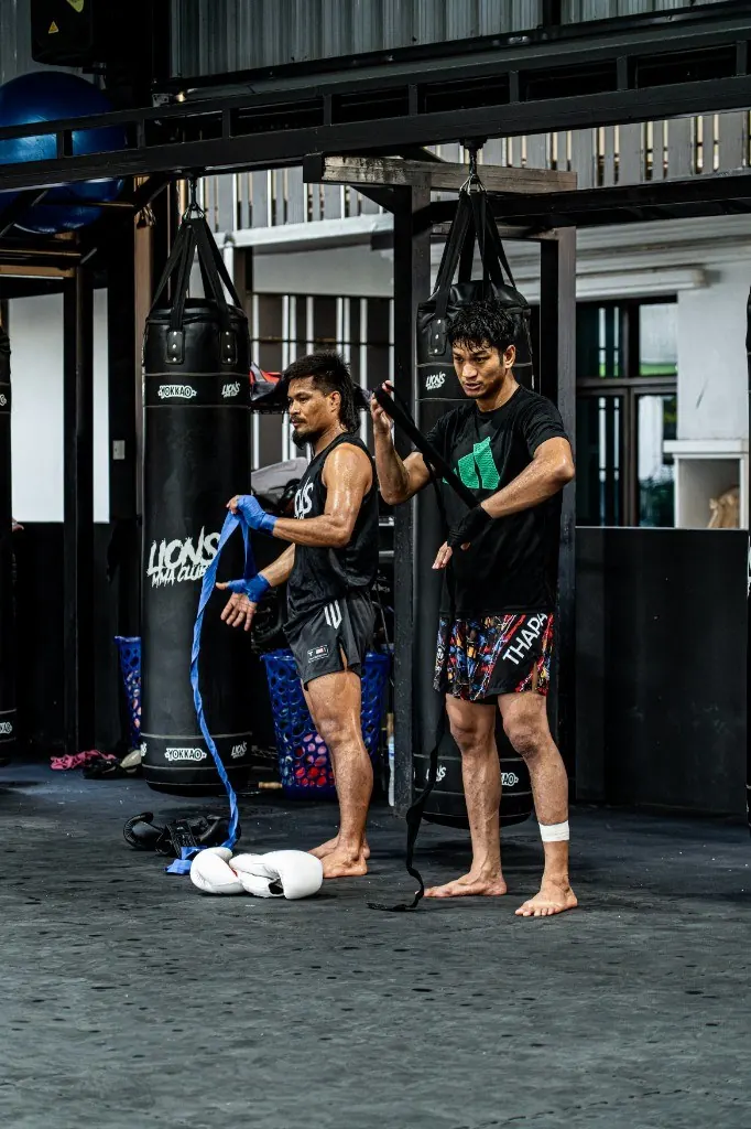Boxing students wrapping hands at Lions MMA Club Phuket