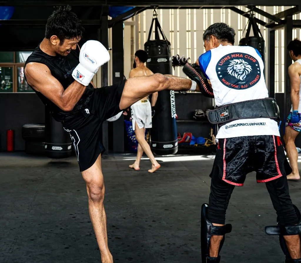 Muay Thai body kick on pads at Lions MMA Club Phuket